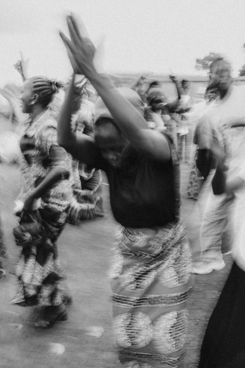 © Jeff Tidwell - A group dances during an outreach
