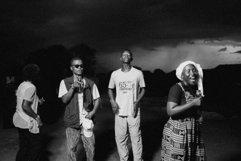 © Jeff Tidwell - A group of volunteers lead worship at one of the outreaches at night
