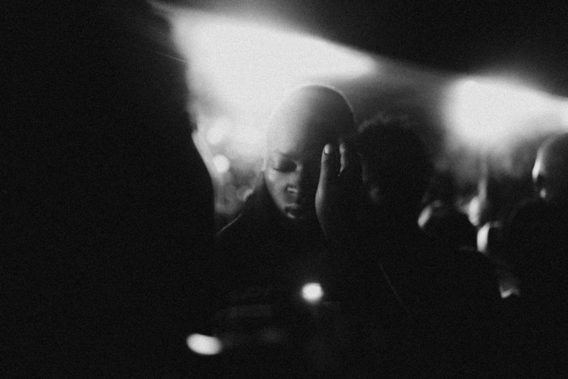 © Jeff Tidwell - A woman recieves prayer at the nighly meetings