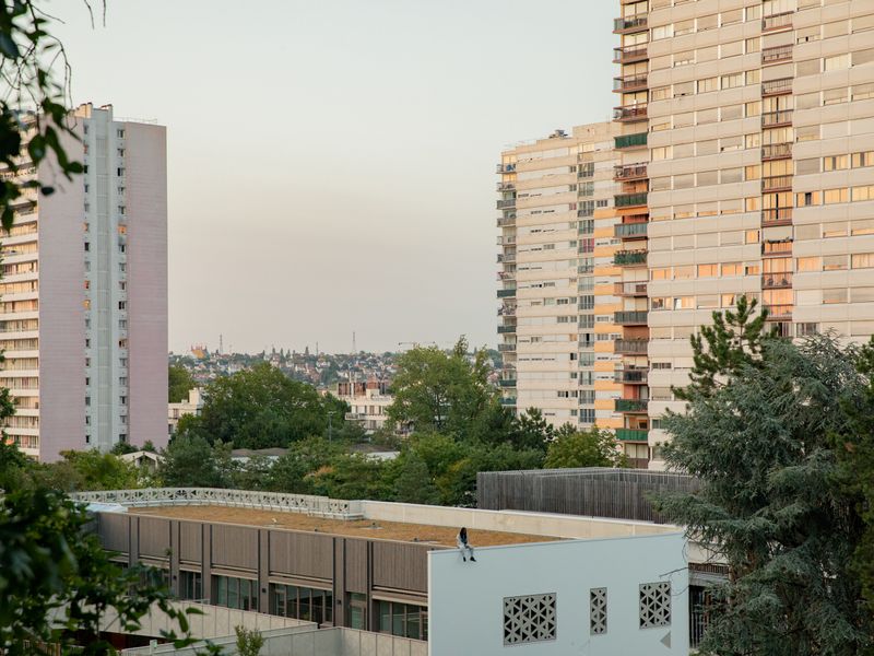 © William Keo - Local resident Ysnear stands on the roof of a school in the "La Zup" housing project in Fontenay-sous-bois.