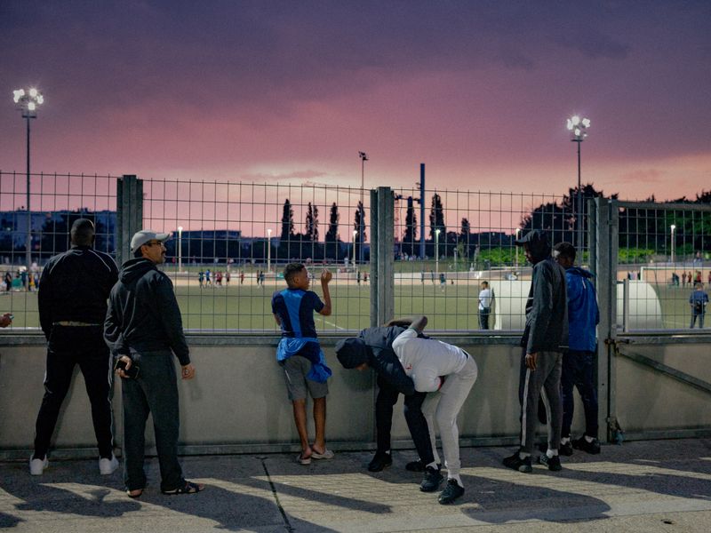 © William Keo - Young men play fight at the Africa Cup of Nations in Aulnay.