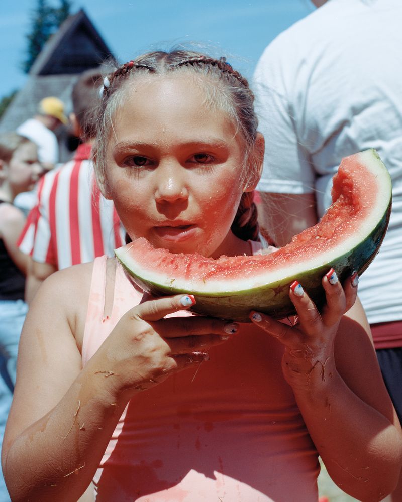 © Marco Waldis - Maxtyn Ward participates at the watermelon-eating competition at the annual Fourth of July festivities.