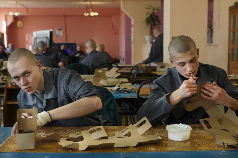 © Tatiana Bondareva - At work. The boys work every day except for weekends. They pack boxes.