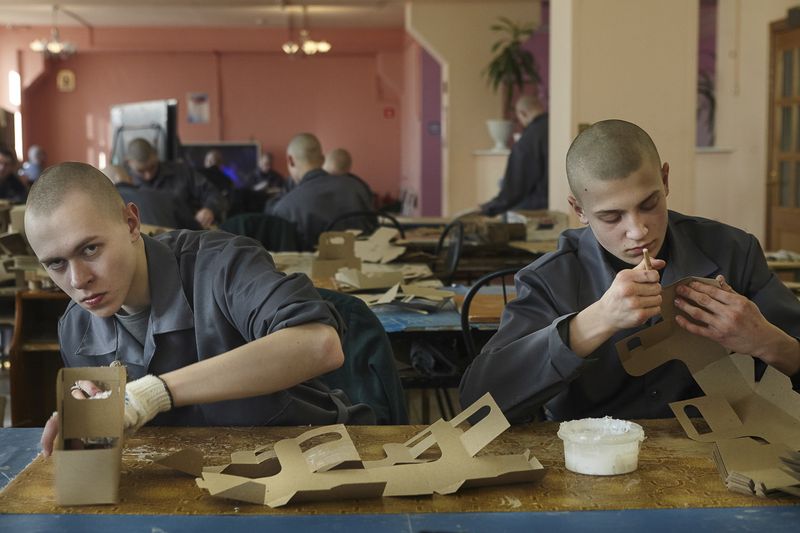 © Tatiana Bondareva - At work. The boys work every day except for weekends. They pack boxes.