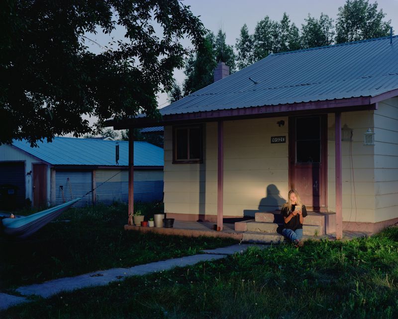© alexander laurent rubalcava - My sister Dominique on her porch at home in Driggs, ID, reading Dostoyevsky's "Crime and Punishment”.