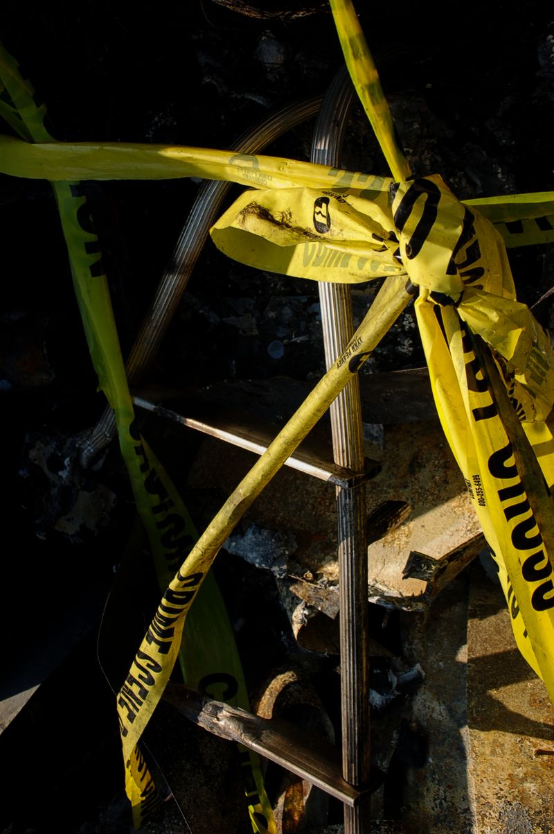 © Erin McMillen Gustafson - Police tape ties the debris together.