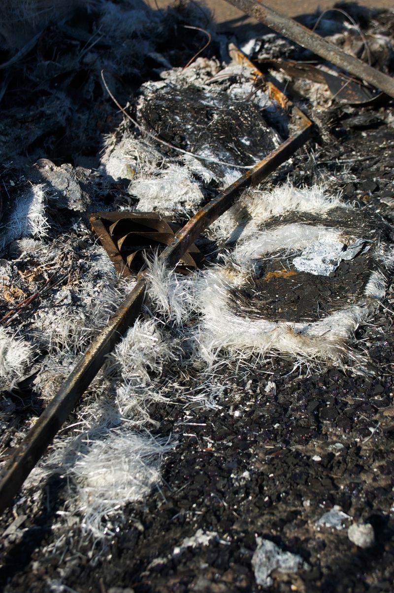 © Erin McMillen Gustafson - Insulation like tinsel fluttered to the ground.