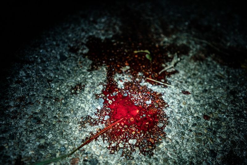 © Zackary Canepari - With the victim already at the hospital, all the remains from this November 2015 shooting is a pool of blood.