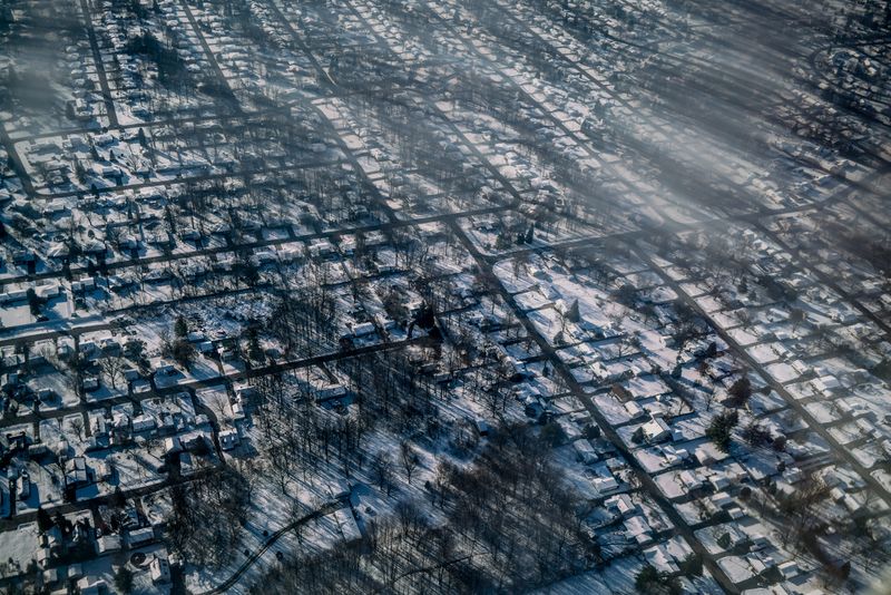 © Zackary Canepari - Flint, Michigan from a dirty plane window.