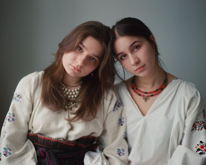 © Anya Tsaruk - Sisters Hannusia and Liubochka wearing traditional Ukrainian clothing on a Christmas weekend.