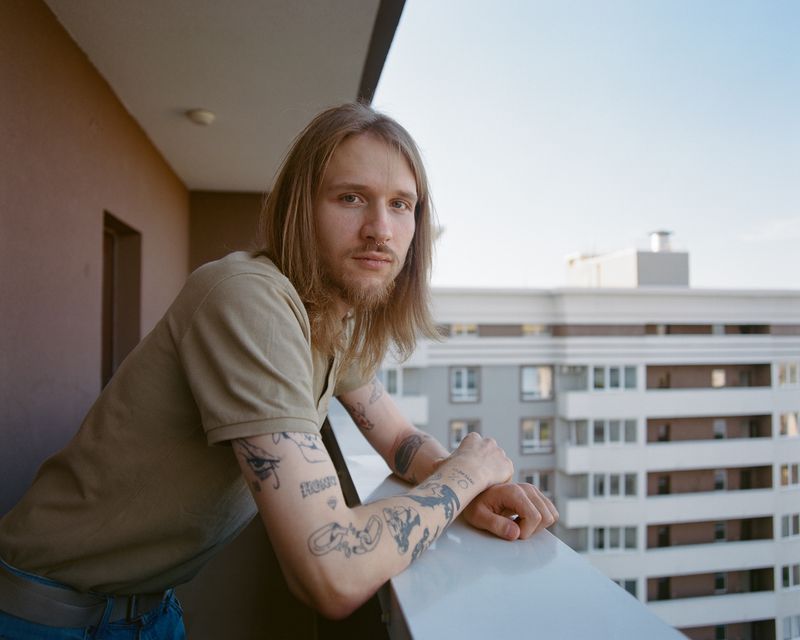 © Anya Tsaruk - My friend Vadym stands on the balcony of his house in Khmelnytskyi.