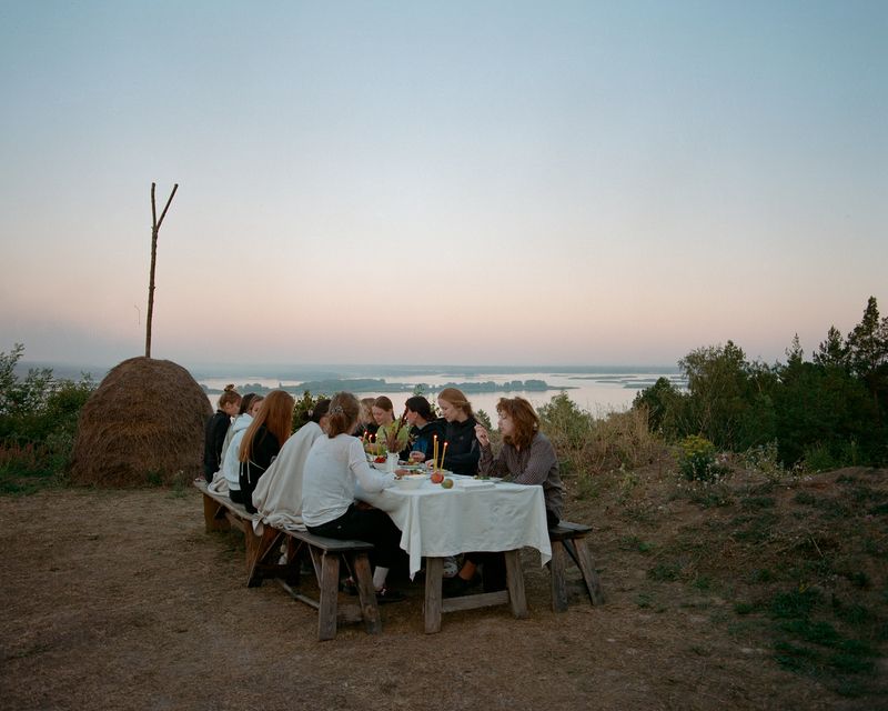 © Anya Tsaruk - A dinner at a weekend yoga camp for women.