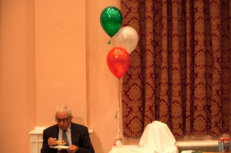 © Antonio Sansica - A man is dining at one of the many parties that are organized by the many Italian associations.