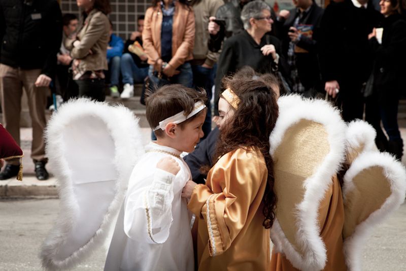 © Antonio Sansica - Children joke between the running procession, they are a big part of the event, also playing in the marching bands.