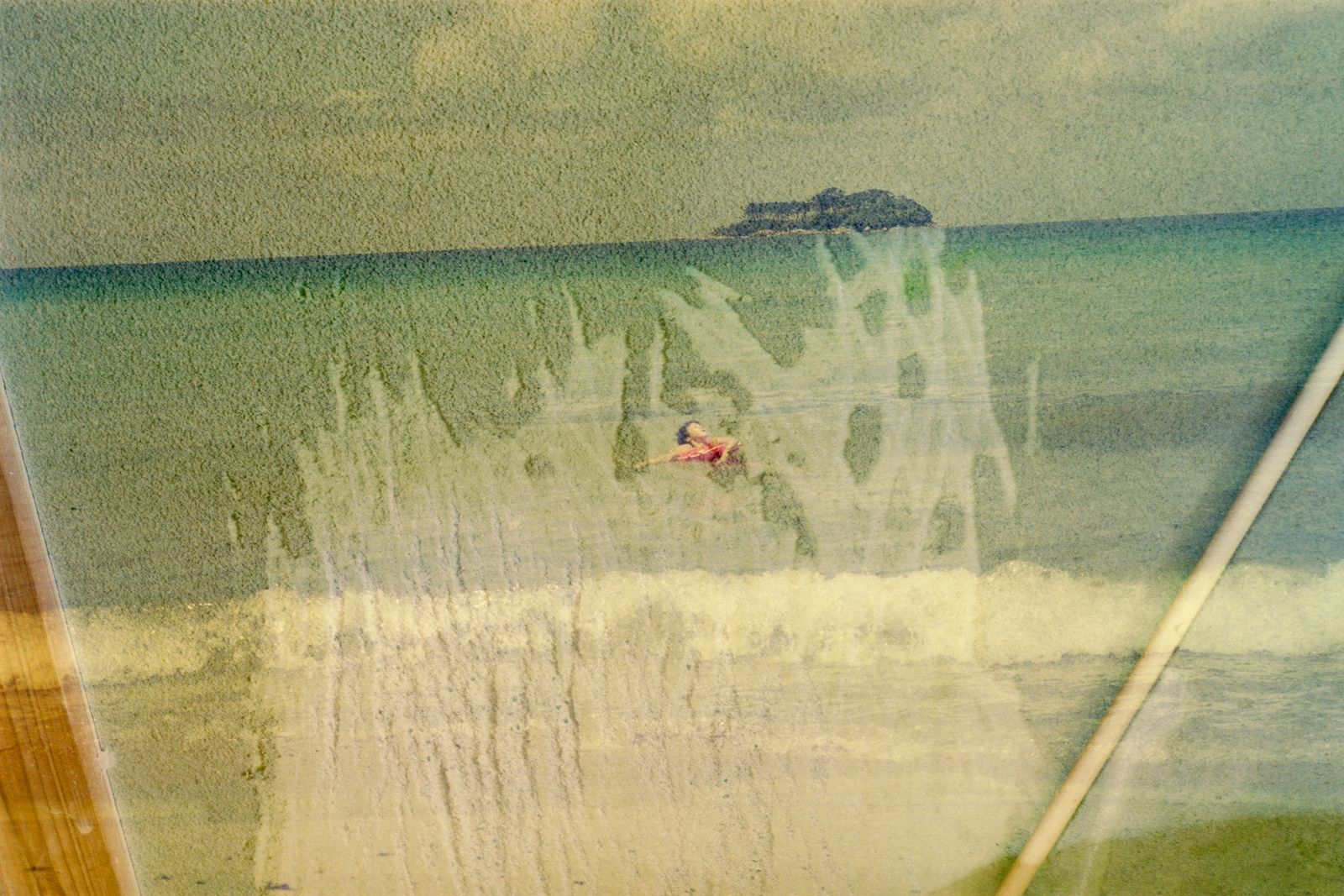 © Sayuri Ichida - My mother swimming in the sea on her honeymoon. And the scratch marks on the wall made by our dog.