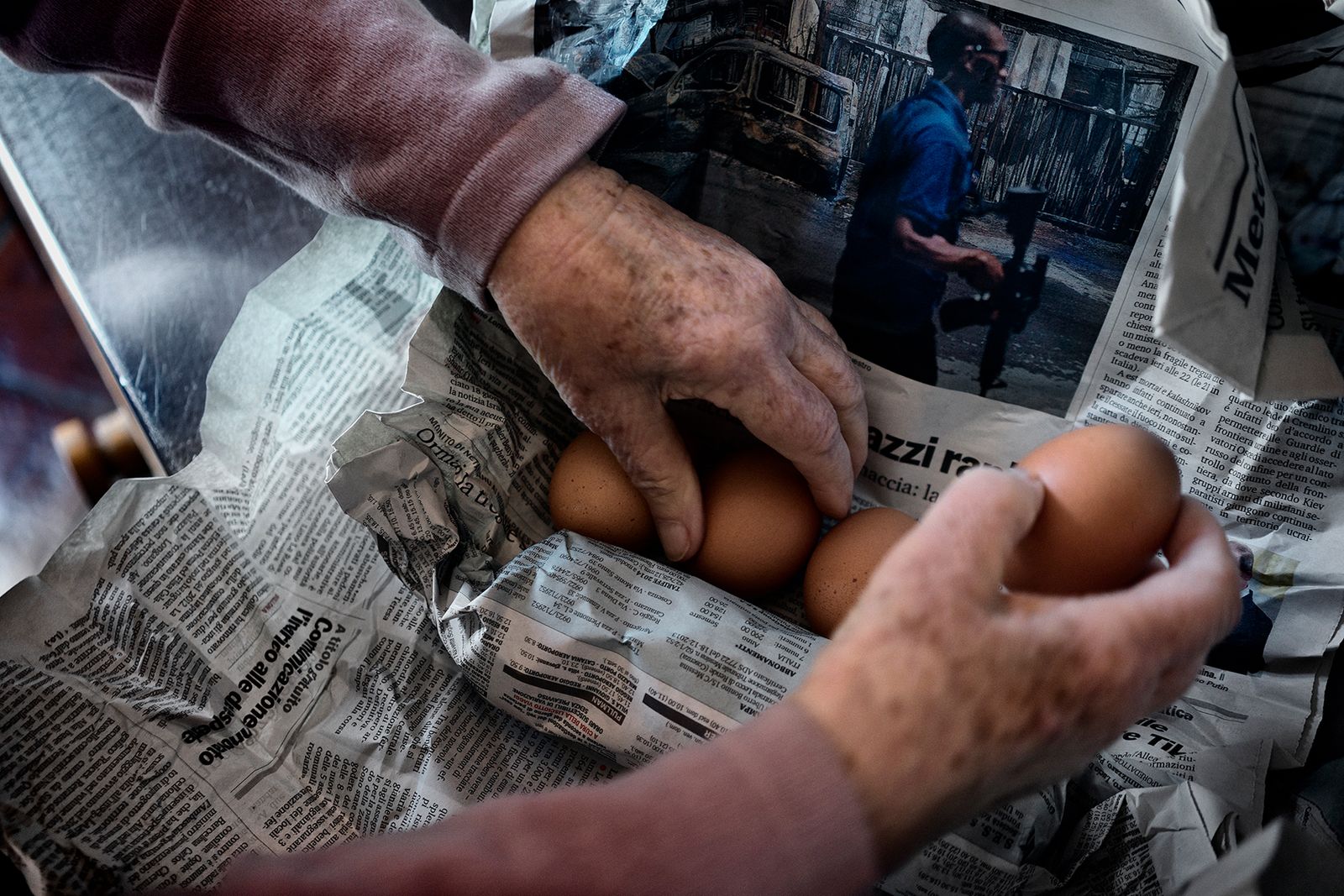 © Simona Bonanno - Every Tuesday Aunt Sara receives fresh eggs from the countryside; they are rolled in a newspaper sheet.
