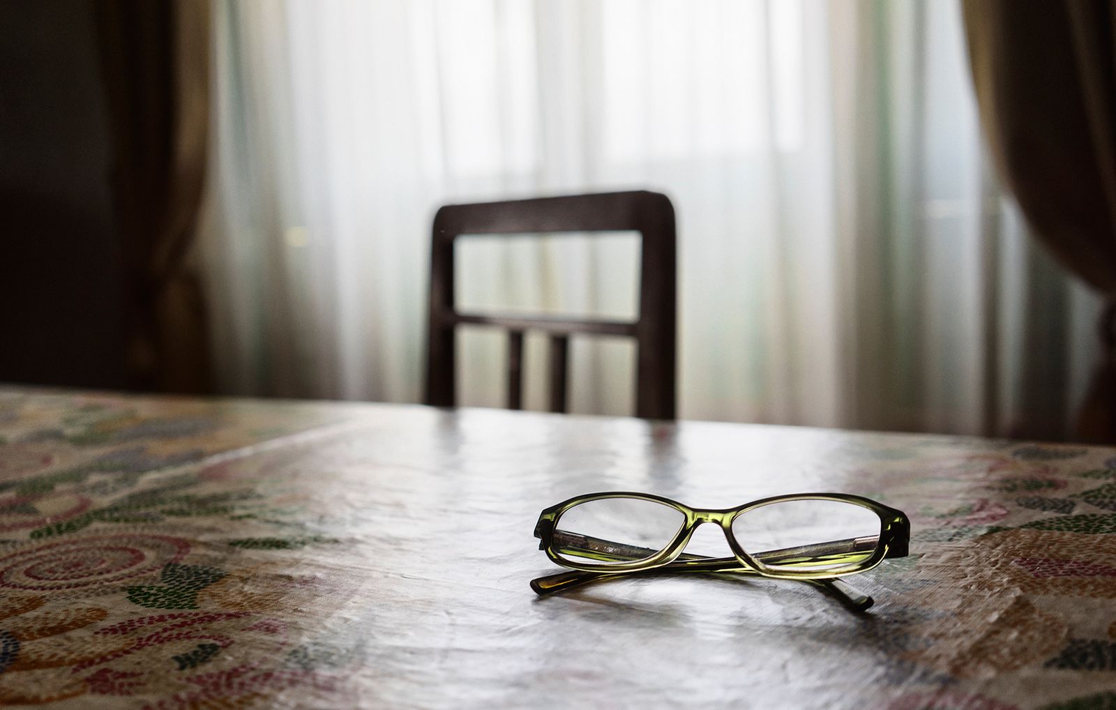 © Simona Bonanno - Her reading glasses on the table of the living room.
