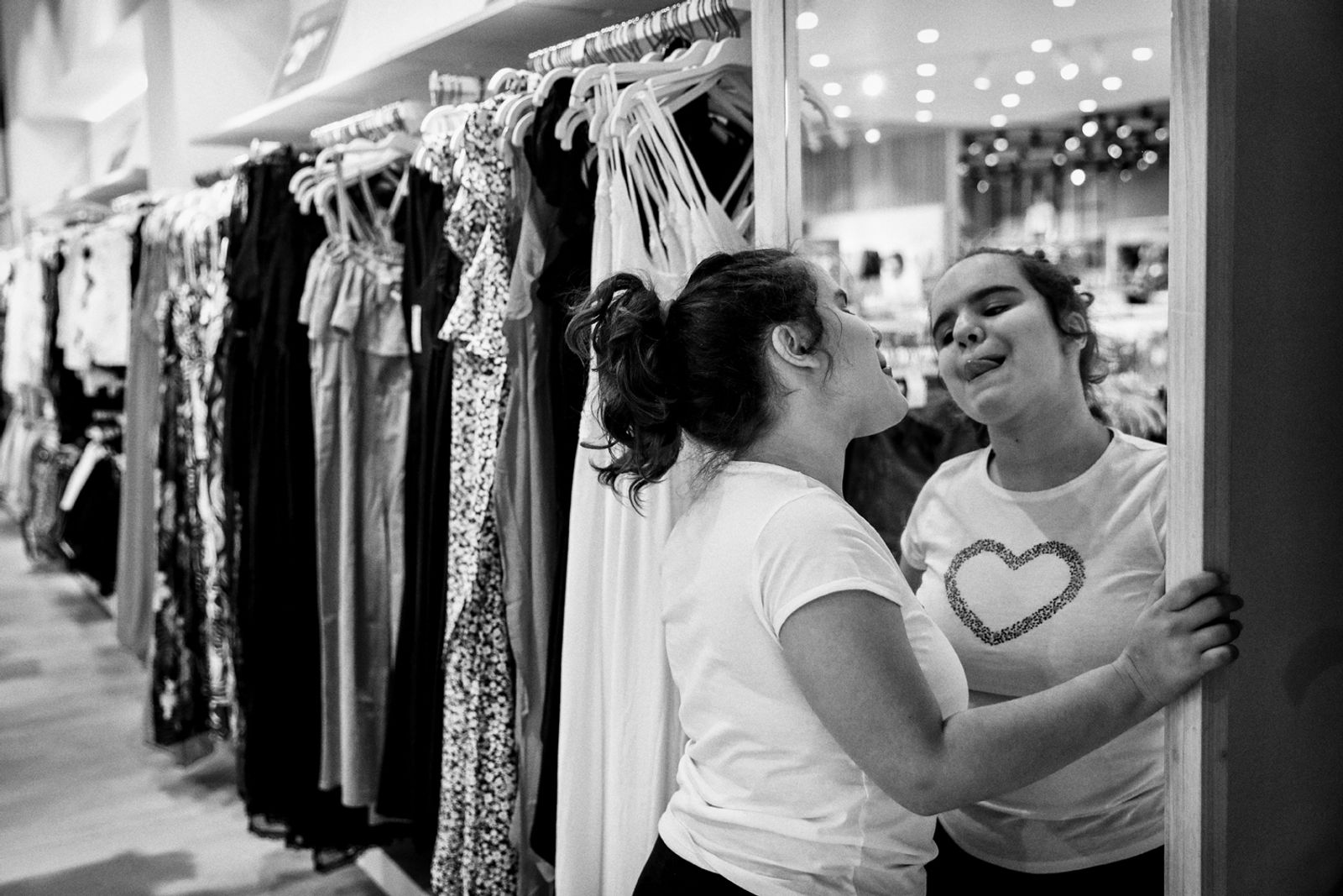 © BARBARA ZANON - Perugia, July 2018: Luisa(12) tries to choose some t-shirts to buy at the supermarket with her outreach worker