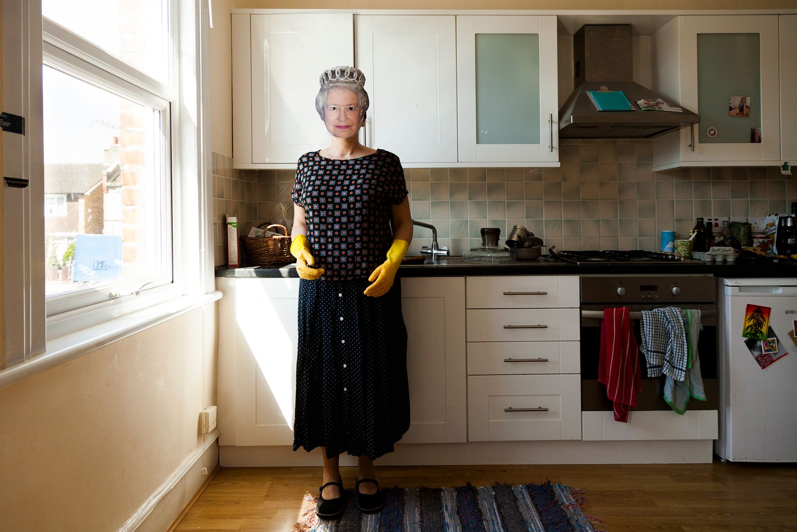 © Michela Carmazzi - "I wish I were Elizabeth in my kitchen" Self-portrait wearing a cardboard mask of Queen Elizabeth in my kitchen.