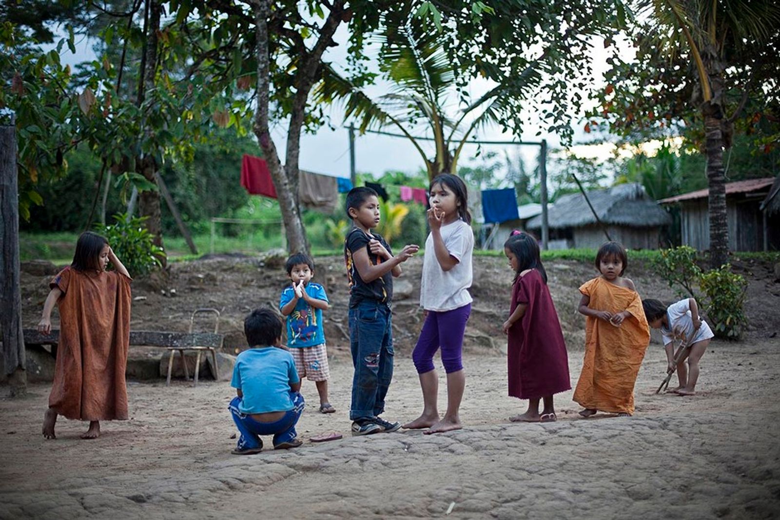 © Marta Moreiras - The kids of the community get together everyday after school at the soccer field and they invent new ways of having fun.