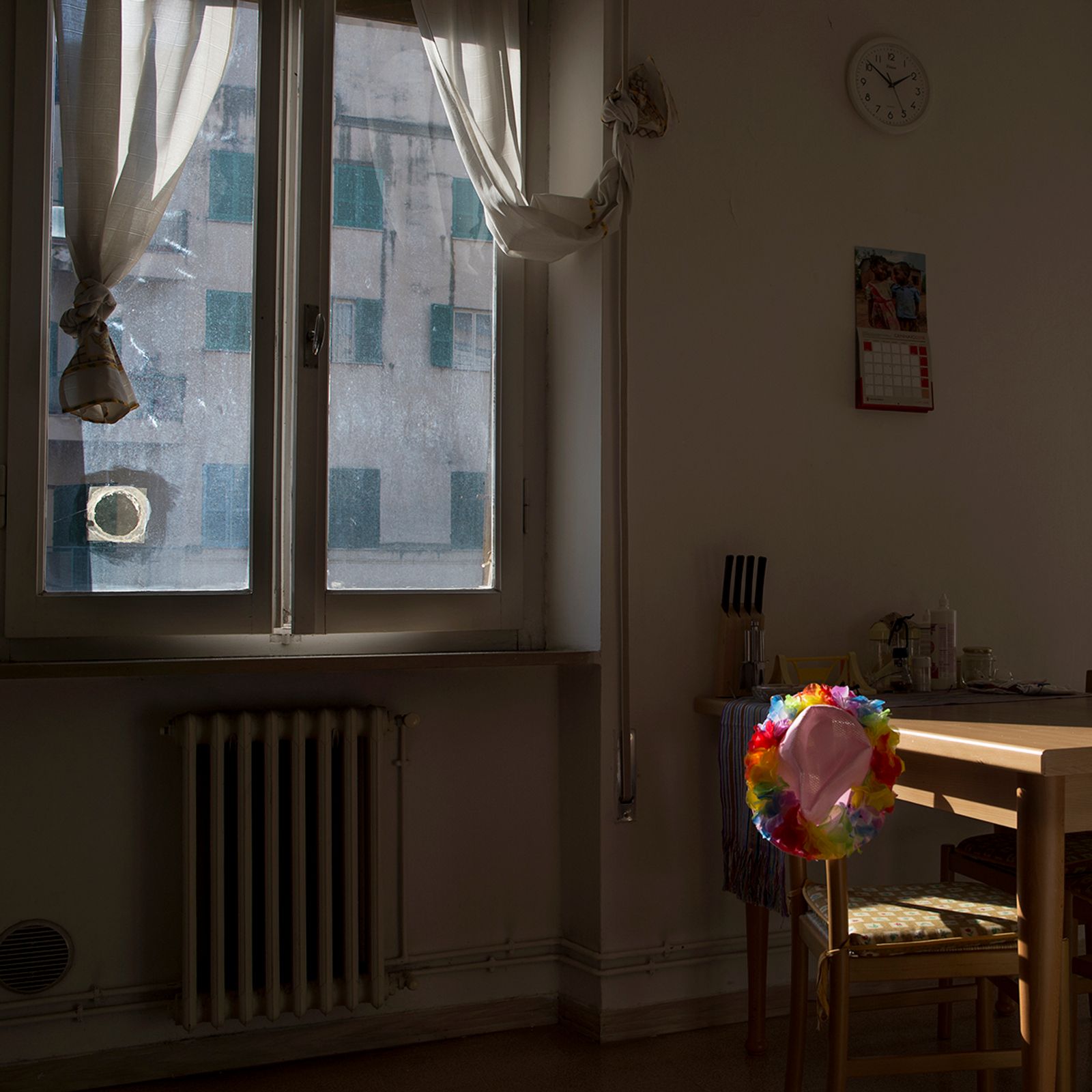 © Melissa Ianniello - A corner of Roberto Tavazzi's house, with the pink and rainbow hat that accompanies him at each Pride (Foligno – Umbria).