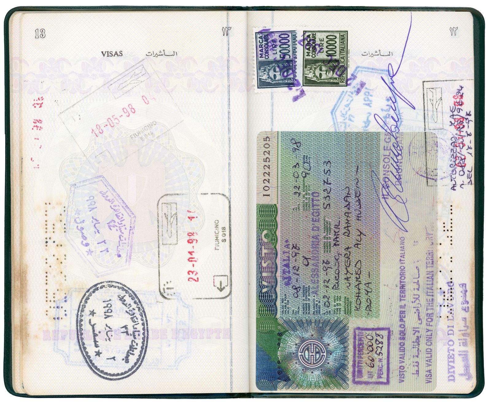 © Nayra Aly - My first Egyptian passport, filled with stamps and visas from our life on the move.