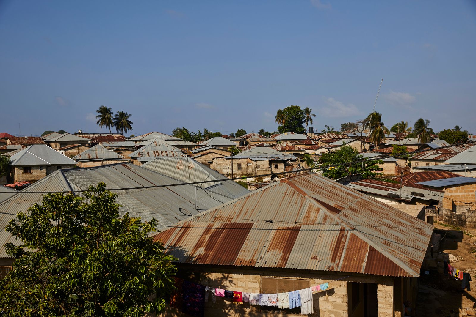 © Nicky Quamina-Woo - Rooftops of homes in Fuoni village just outside of Zanzibar City, Tanzania