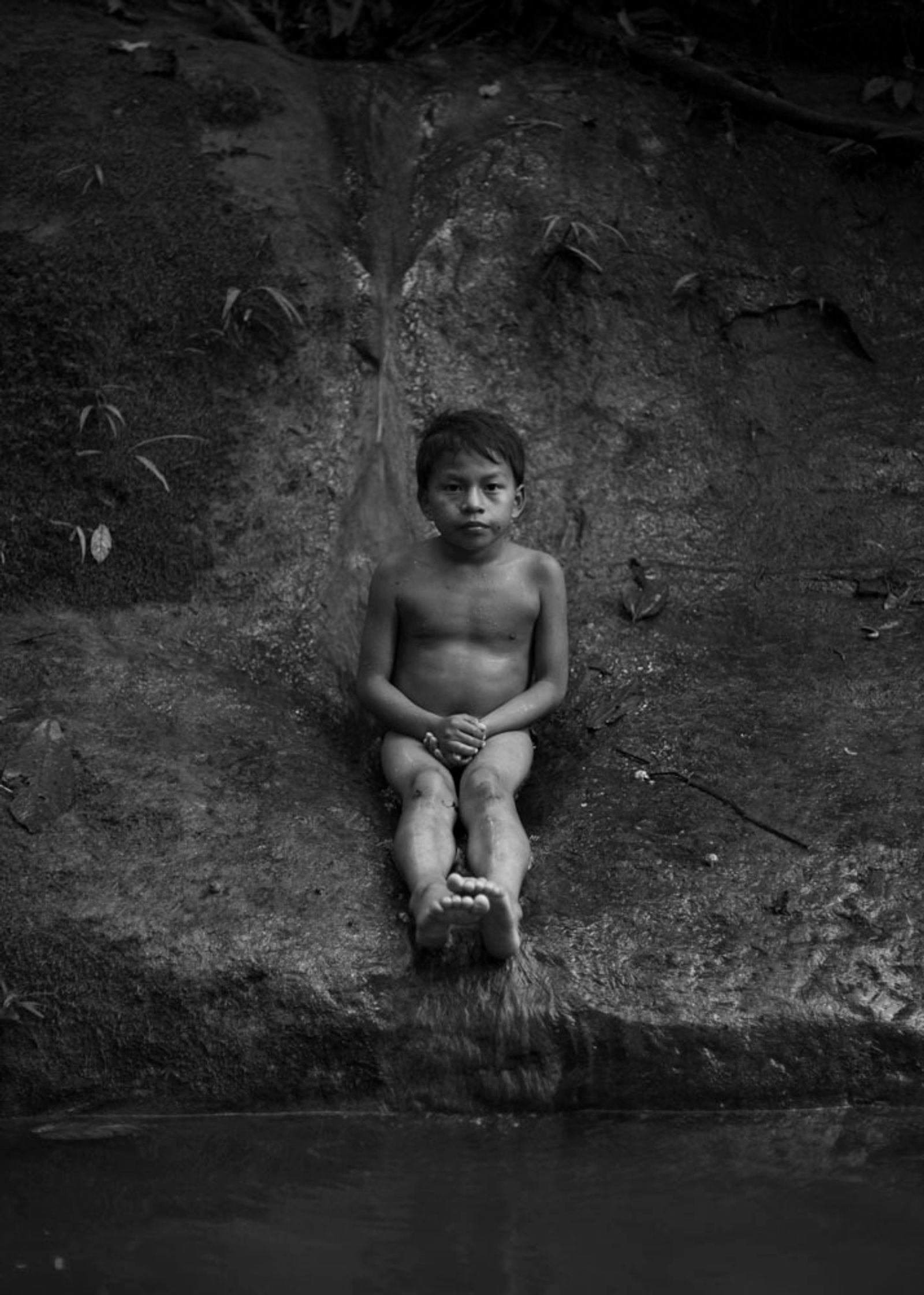 © Daniela Beltran B. - A portrait of Ismael, Naime's son on a natural water slide.