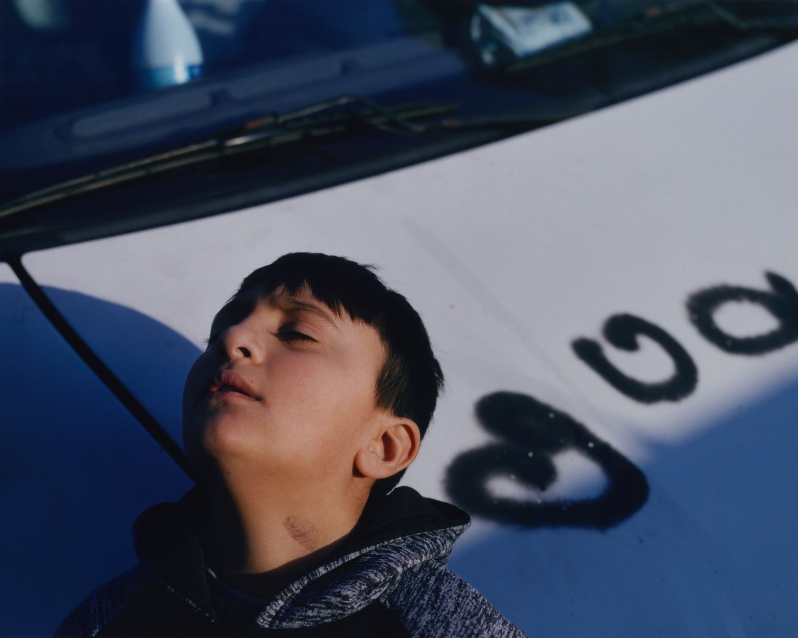 © Alexandre Silberman - Roberto, young gypsy, in front of the family van // Aubervilliers // December 2019