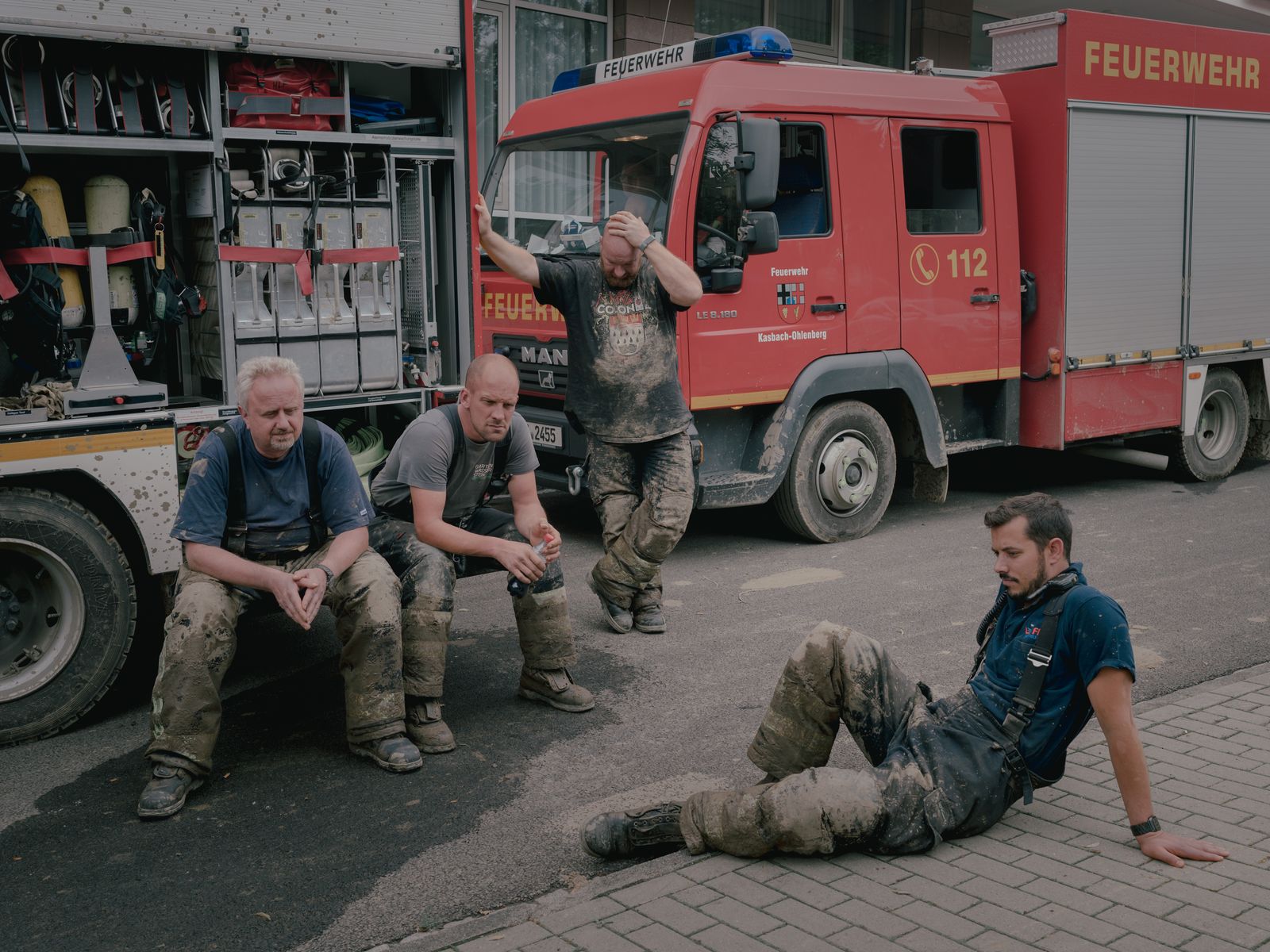 © DOCKS Collective - Volunteer firefighters from Vettelschoss take a break in Bad Neuenahr-Ahrweiler, Germany on July 17. 2021.