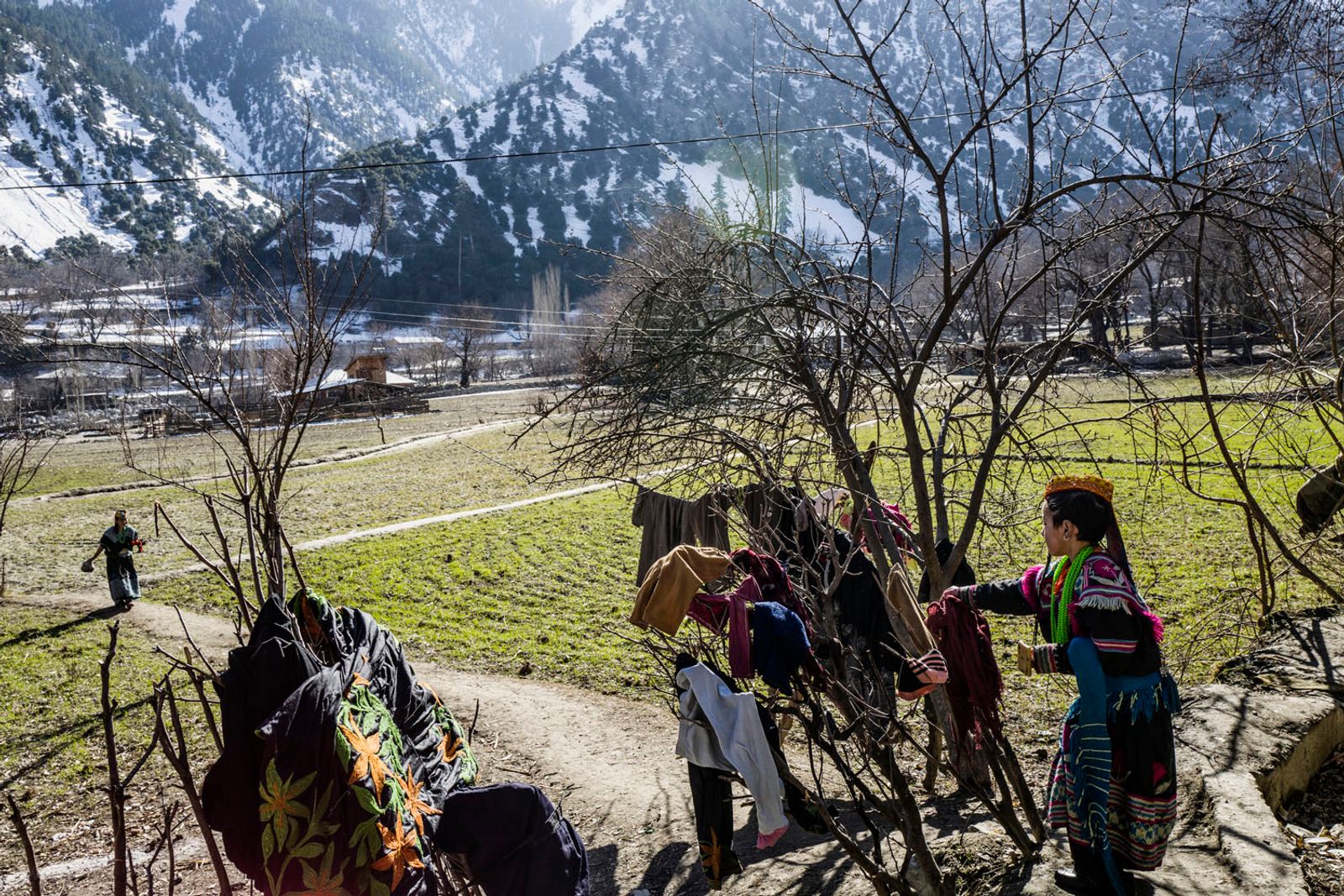 © Sarah Caron - Laundry is done in the streams running through Kalash valley only on days when the winter sun comes out.