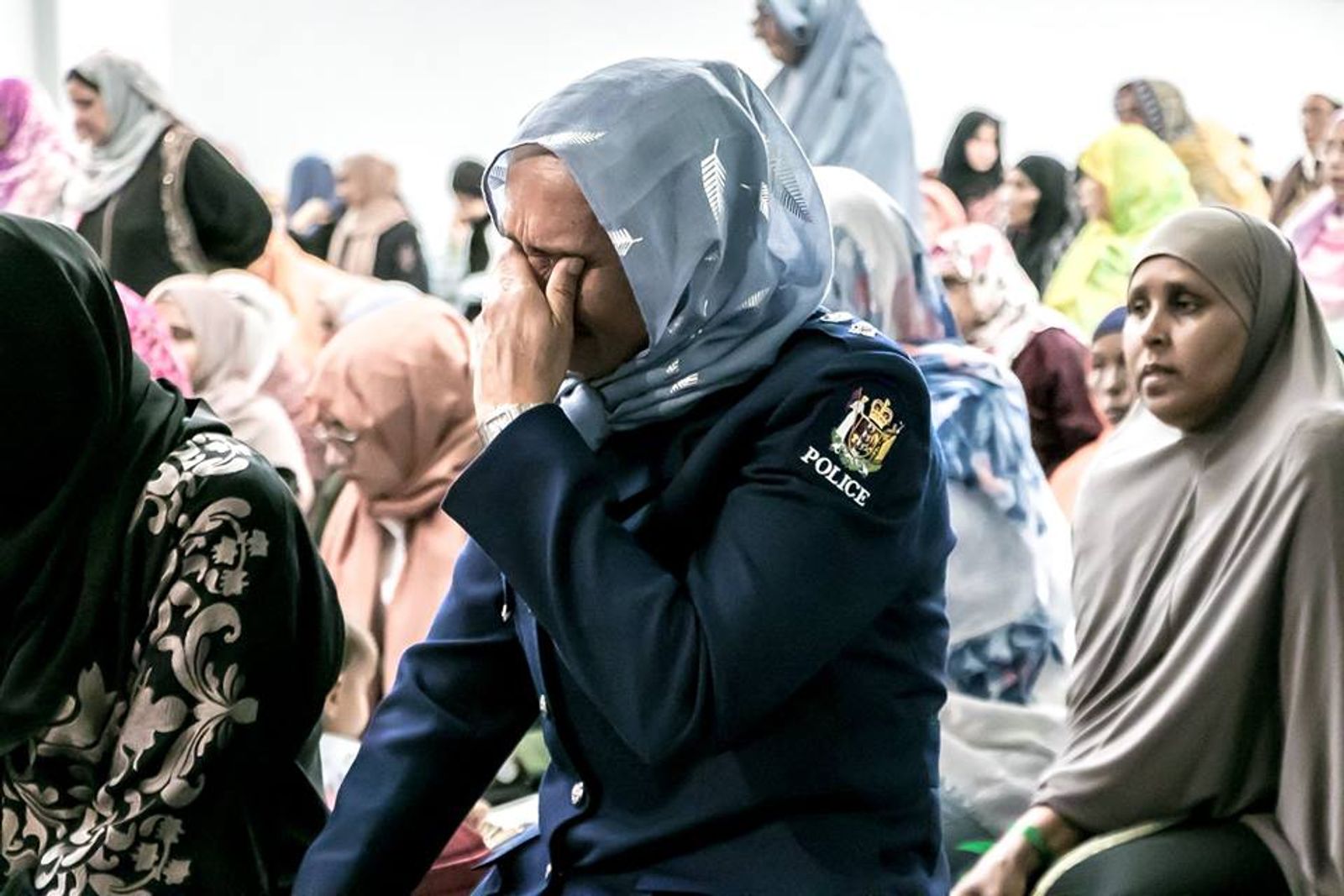 © Serena Stevenson - A Muslim woman New Zealand police officer morns openly during the Auckland Memorial.