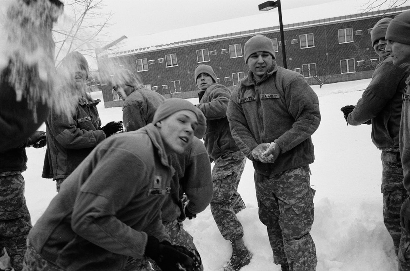 © Erin Trieb - Us infantry soldiers have snowball fight on, Fort Drum, New York. Jan 2010.