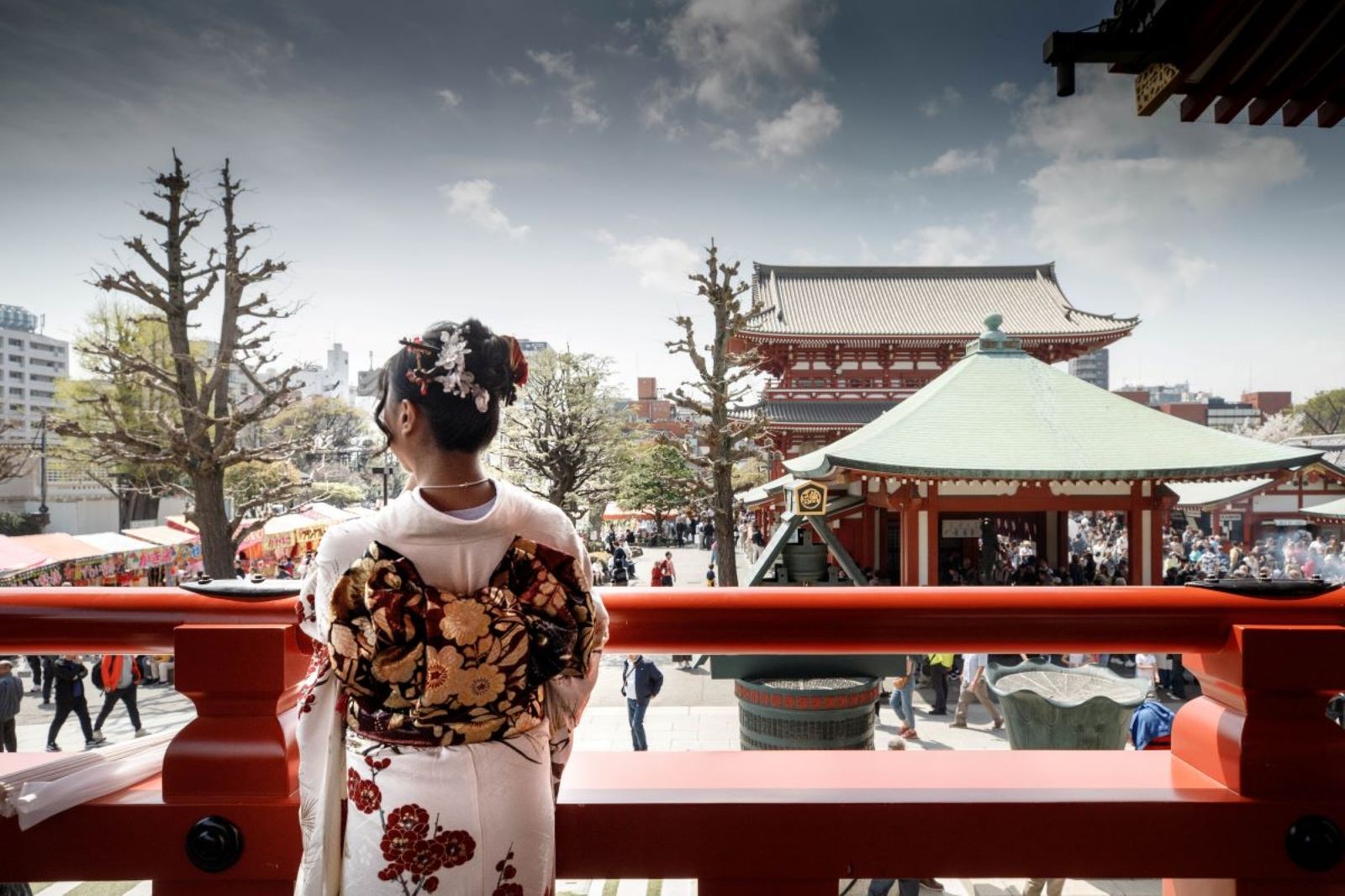 © ROBERTA LODI - "Woman in Kimono at Temple"     A woman in kimono seen from behind, overlooking a temple courtyard.