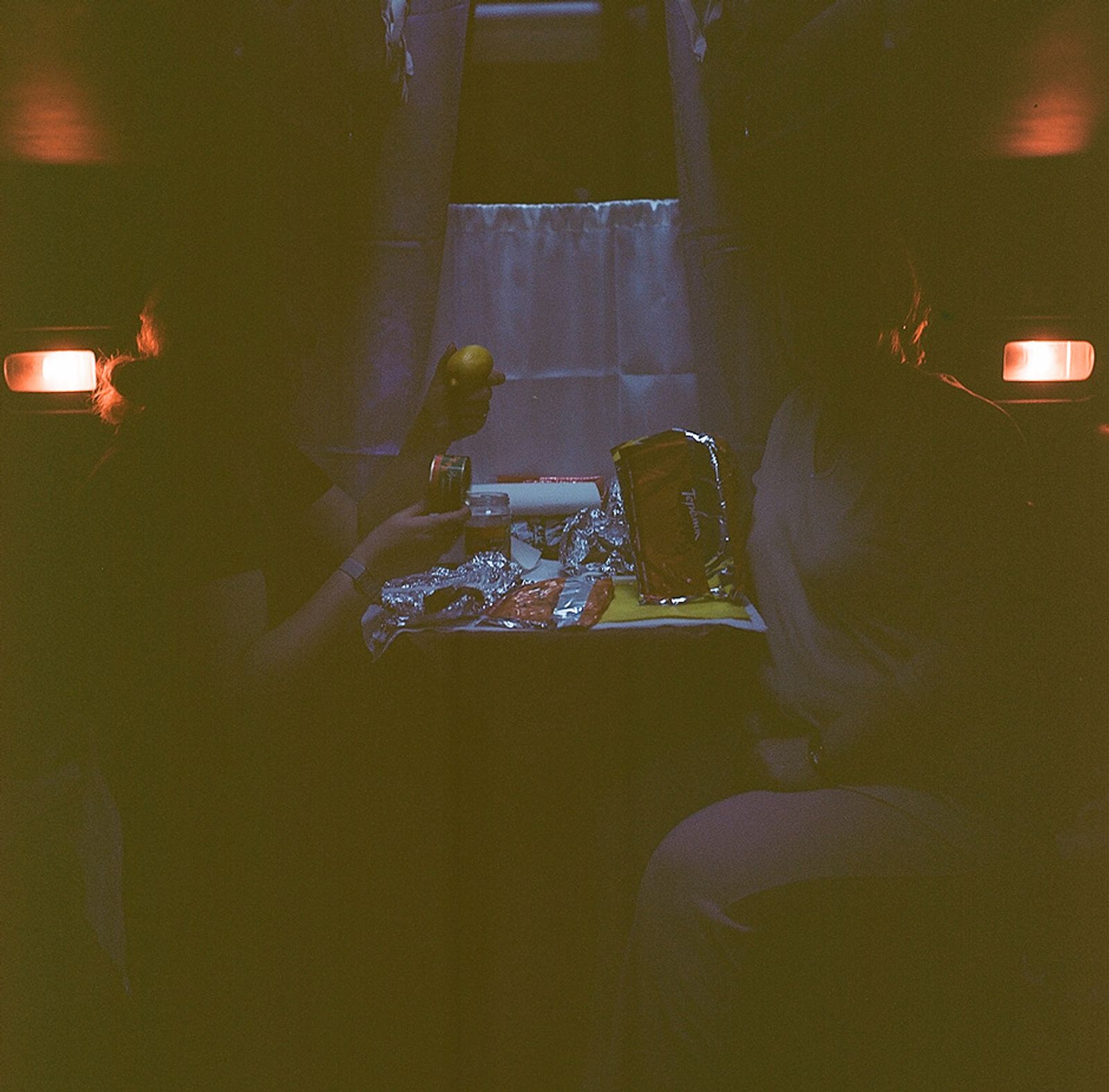 © Natalia Shlyakhovaya - At the train on the way from Russia to Ukraine. Eating salmon caviar and russian crepes called "bliny".