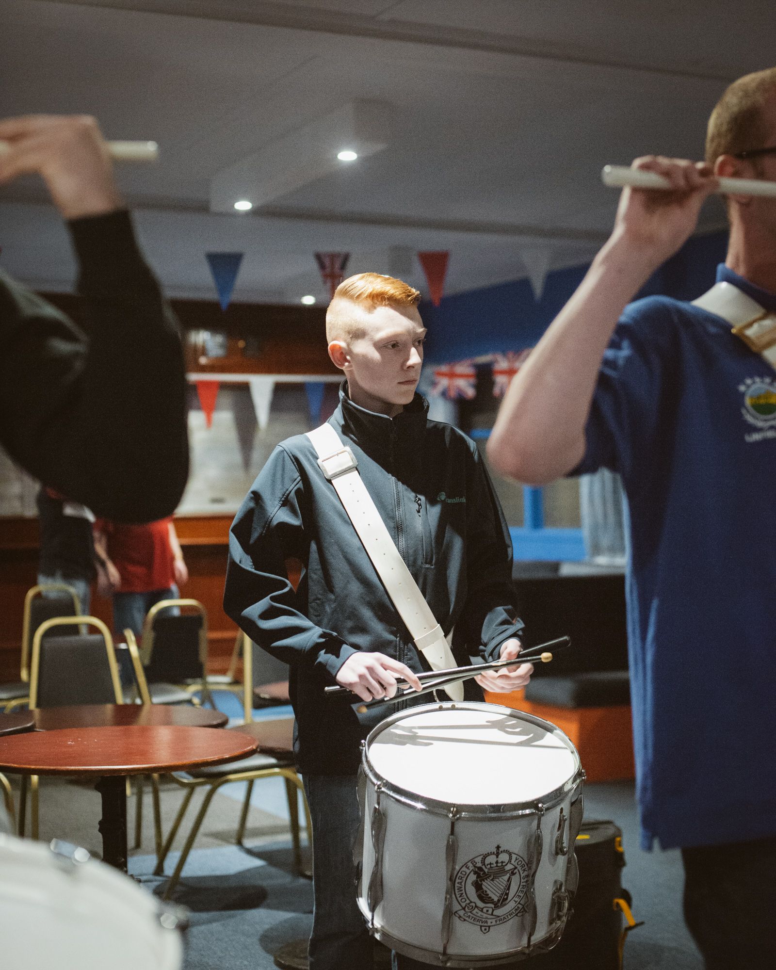 © Jens Schwarz - Boy at marching band rehearsal, Linfield social club, Protestant Upper Shankill area, Belfast, Northern Ireland 07/2017