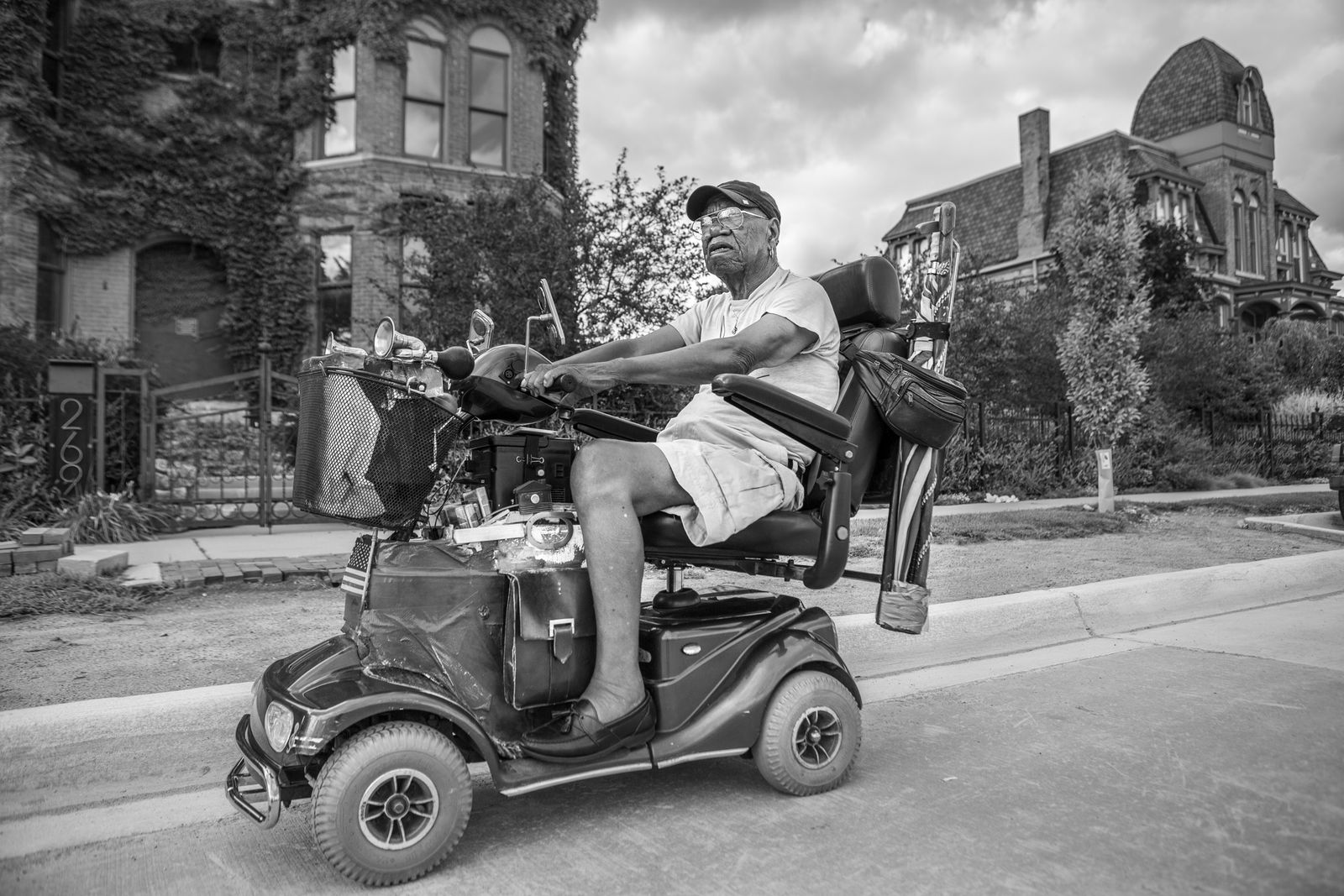 © JANICE MILHEM - Lee riding his motorized scooter through Detroit's Historic Brush Park.