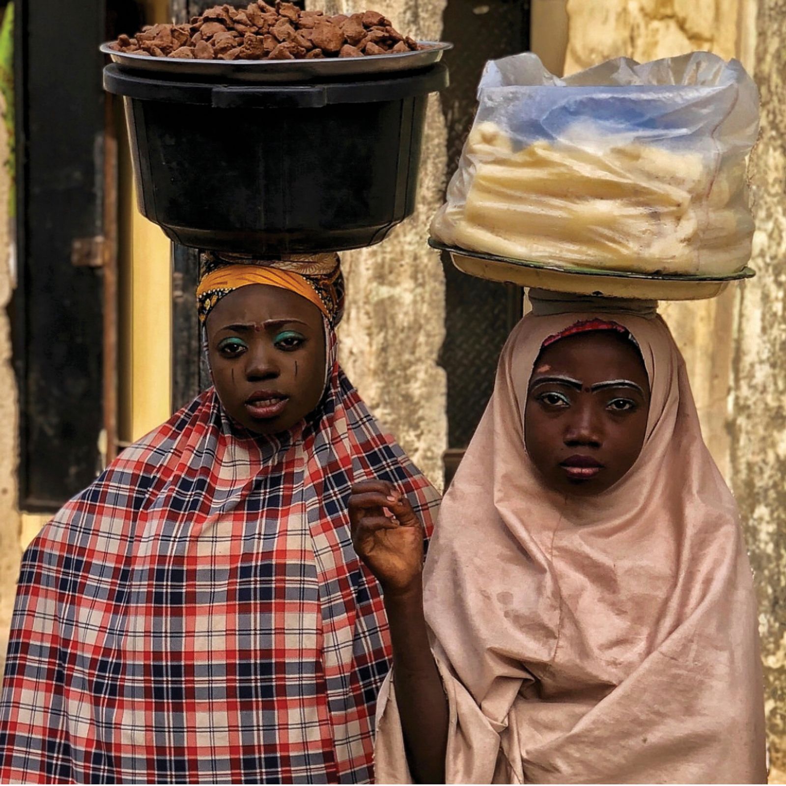 © Nwando Ebeledike - This photo was taken in Kano, Nigeria and is a photo of two friends hawking complimentary products