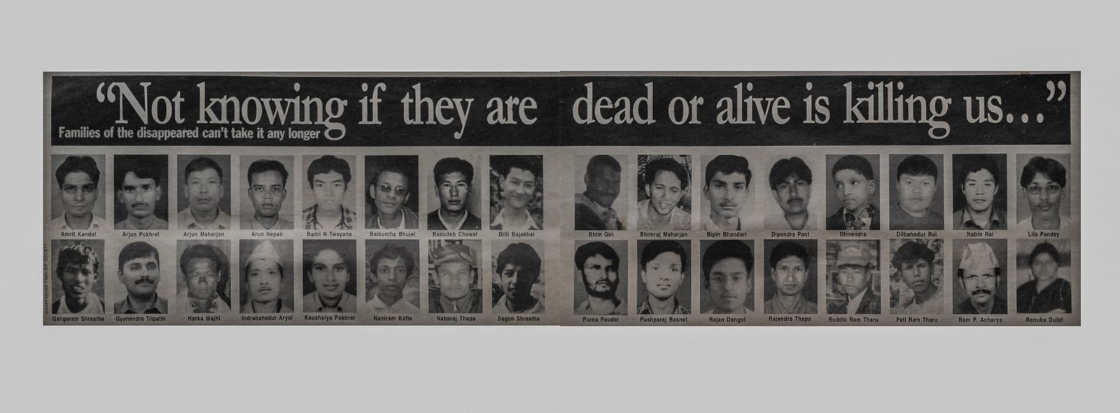 © Stephen Dock - A newspaper clipping showing the faces of dozens of missing people.