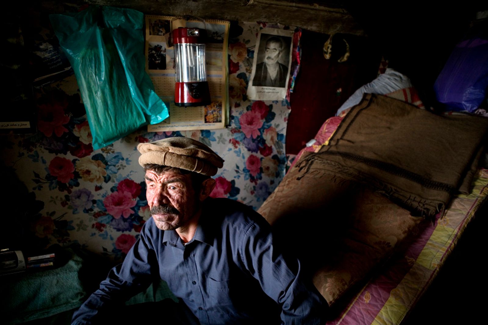 © Daniel Pilar - Portrait of a man sitting on his bed in a residential house in the borough of Shur Basar in Kabul on september 26th 2007.