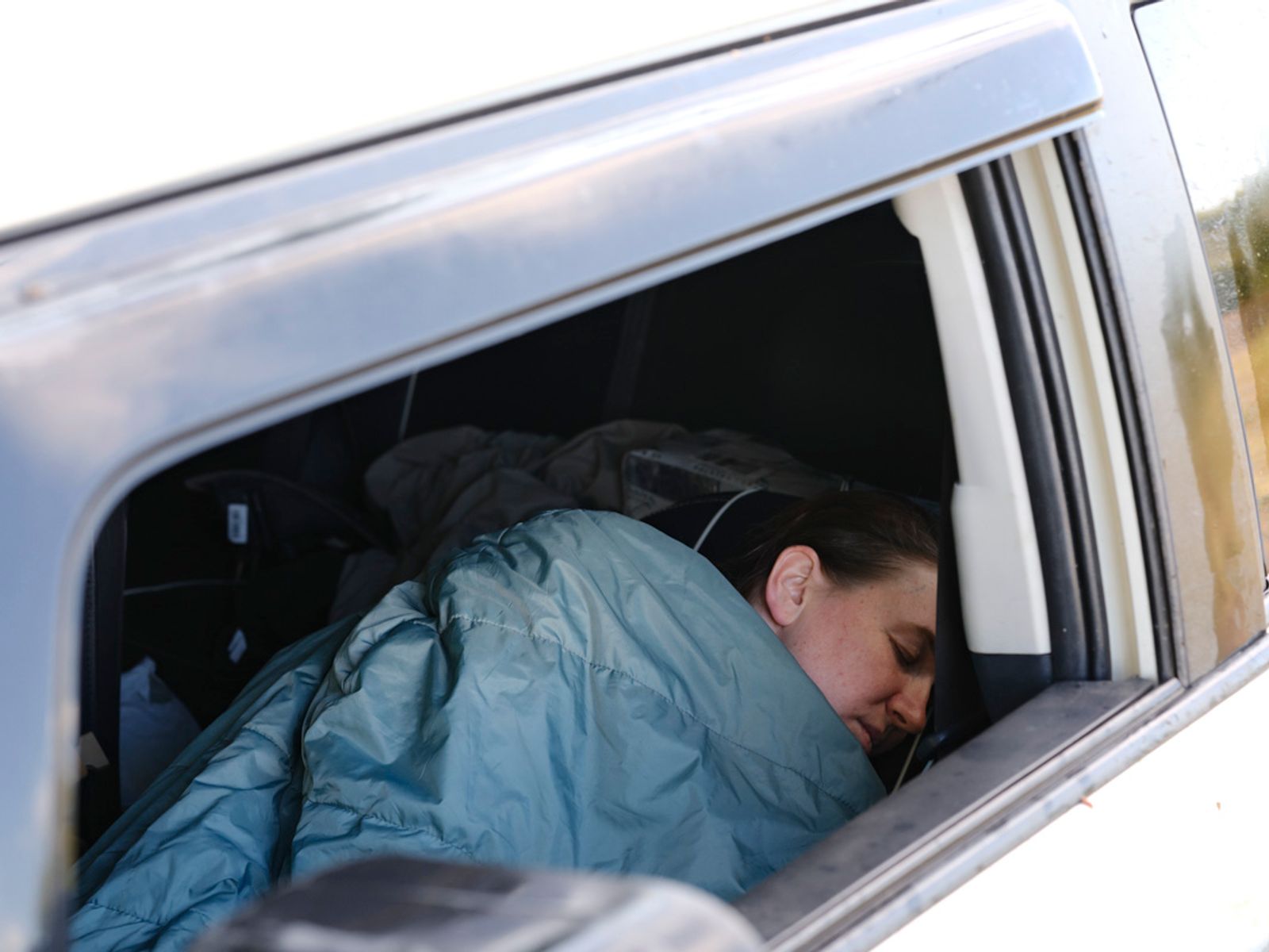 © Marysia Myanovska - Andriana in her only personal space at the front—in her own car. Here she sleeps, washes up, and can have some time alone.