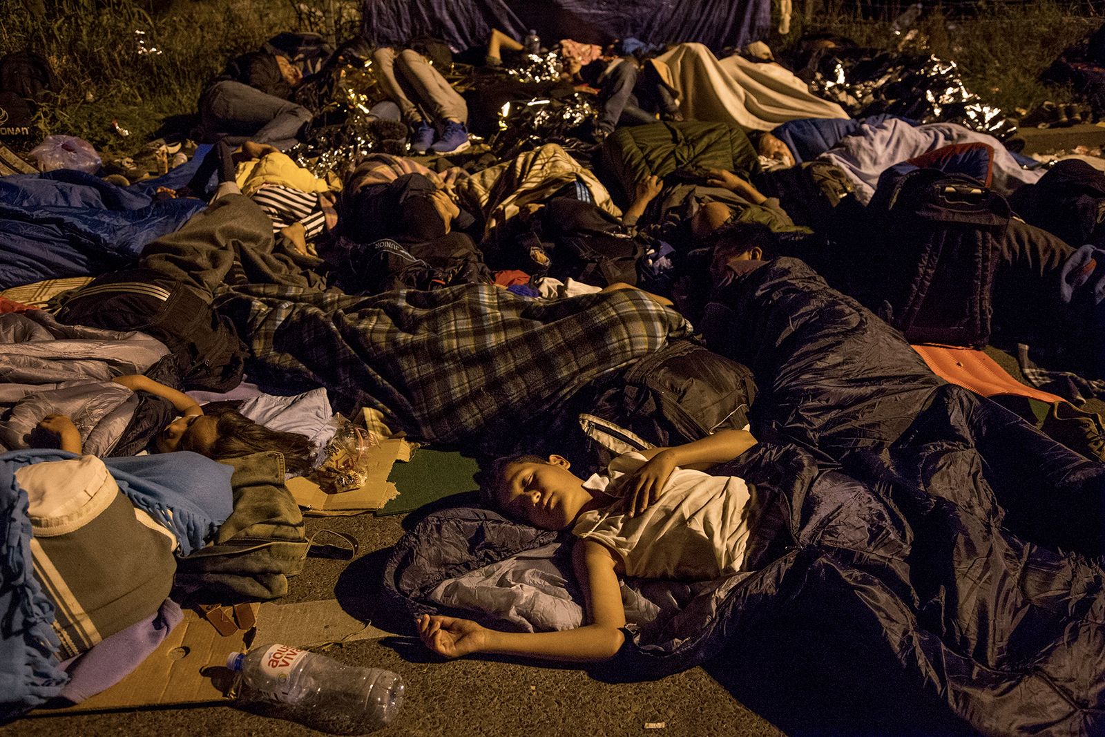 © Alessio Paduano - Migrants sleep on the street near the Serbian border with Hungary in Horgos, Serbia on September 15, 2015.