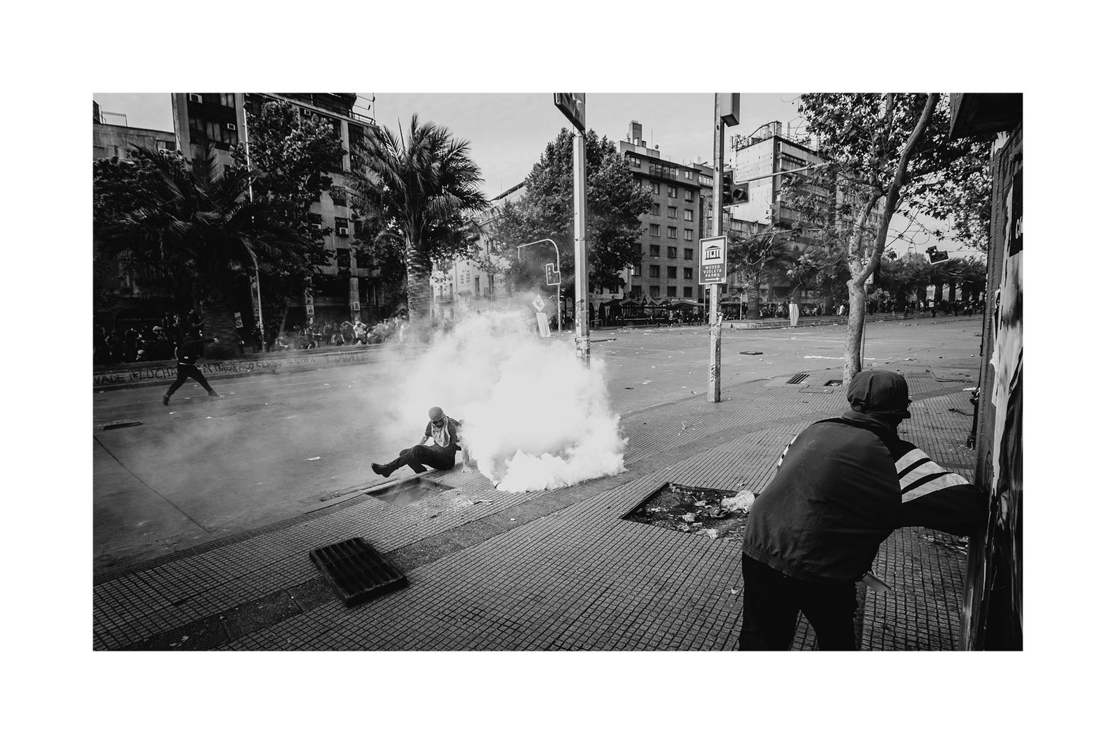 © Matias Cortez - Man getting hit by tear bomb shoot