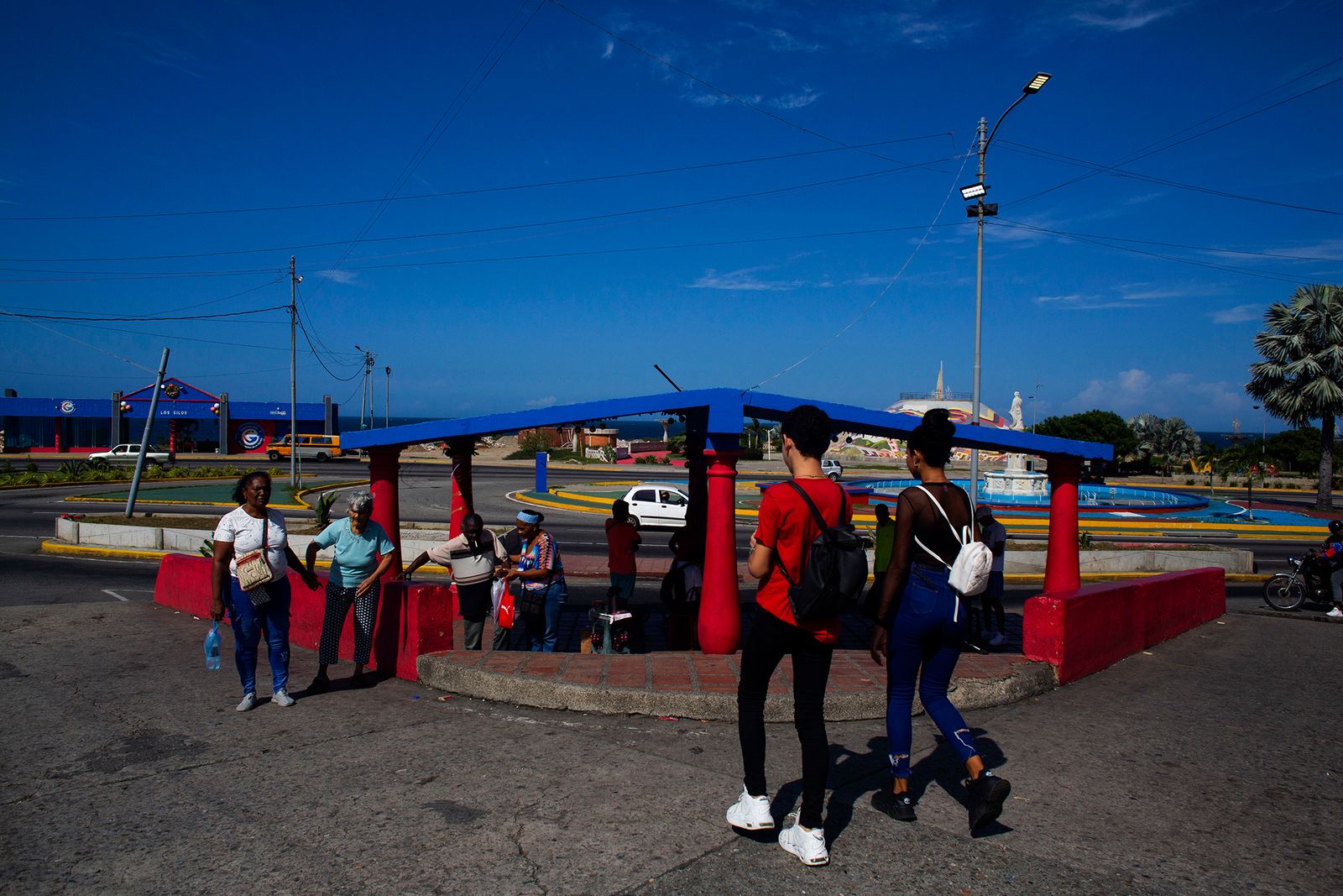 © Freisy González Portales - People walking through the Los silos bus stop. One of the bus stops near the old town of La Guaira, in the Soublette Avenue
