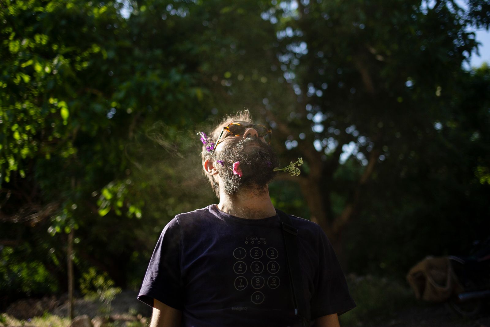 © Parisa Azadi - JUNE 4, 2019 - Hamed Jaberha blows smoke into the air during a road trip with his friends in Barzok, Iran.