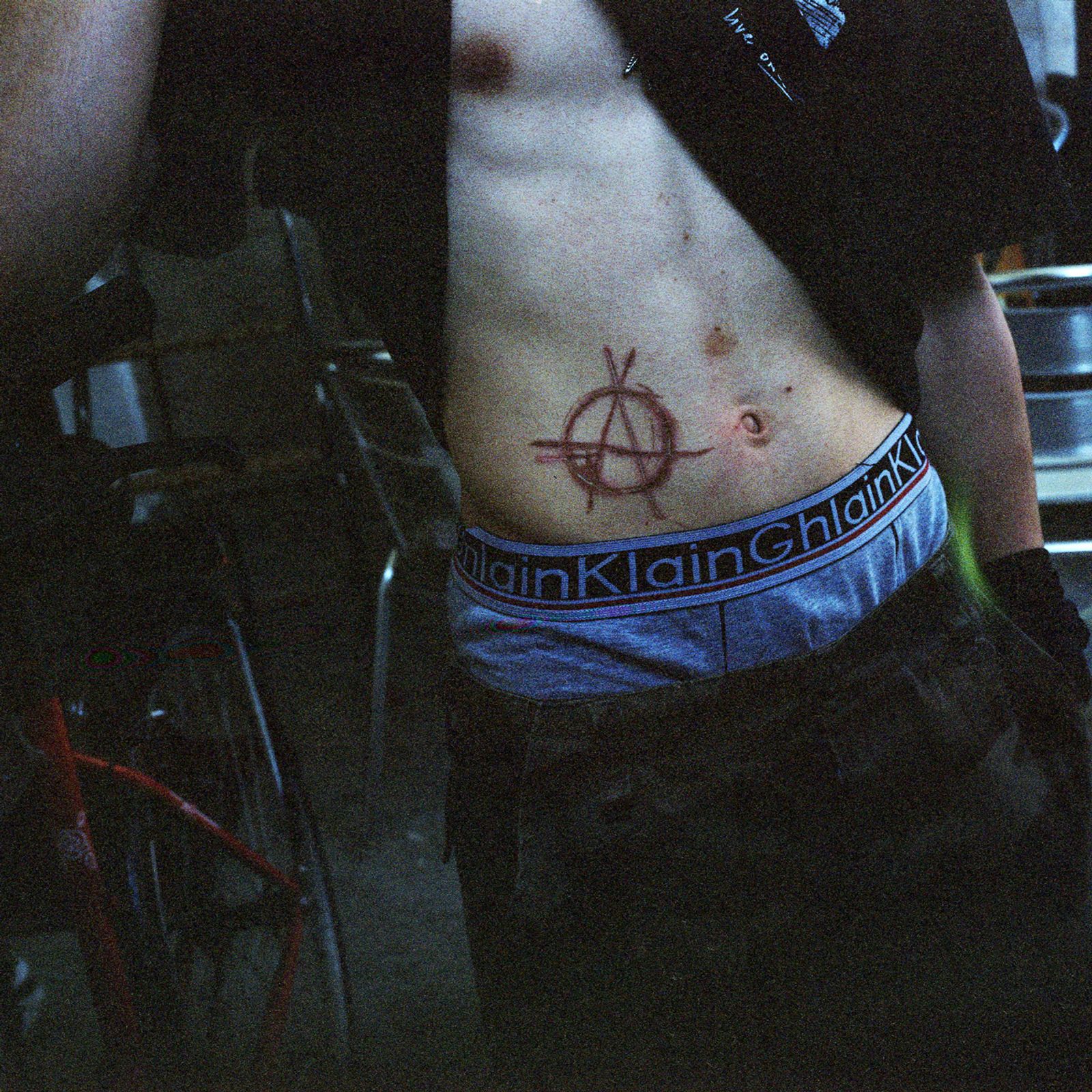 © Chiara Fossati - Anarchy engraved with a knife on my neighbour's belly