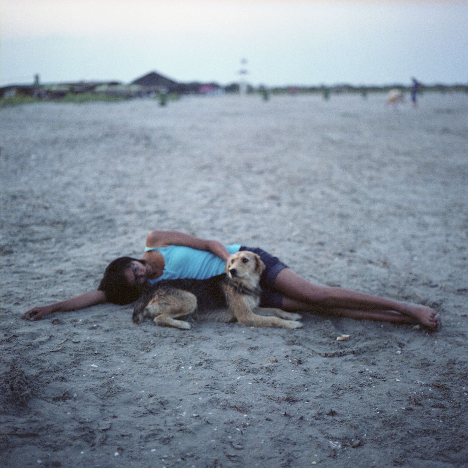 © Chiara Fossati - Jesse, 19 years old and stray dog on the beach of Sulina , Romania.