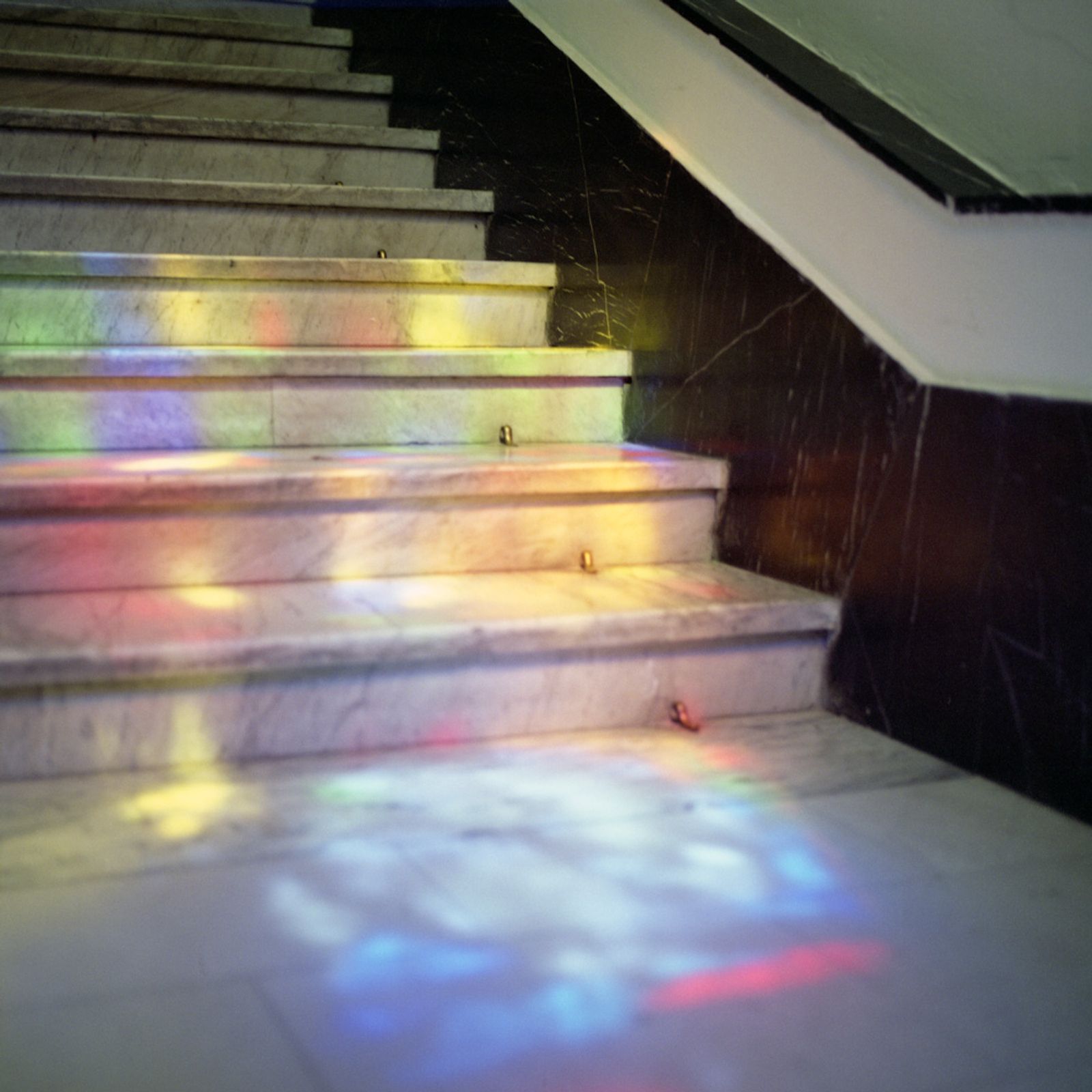 © Chiara Fossati - The reflection of a stained glass window on the stairs of a photography museum in Budapest, Hungary.