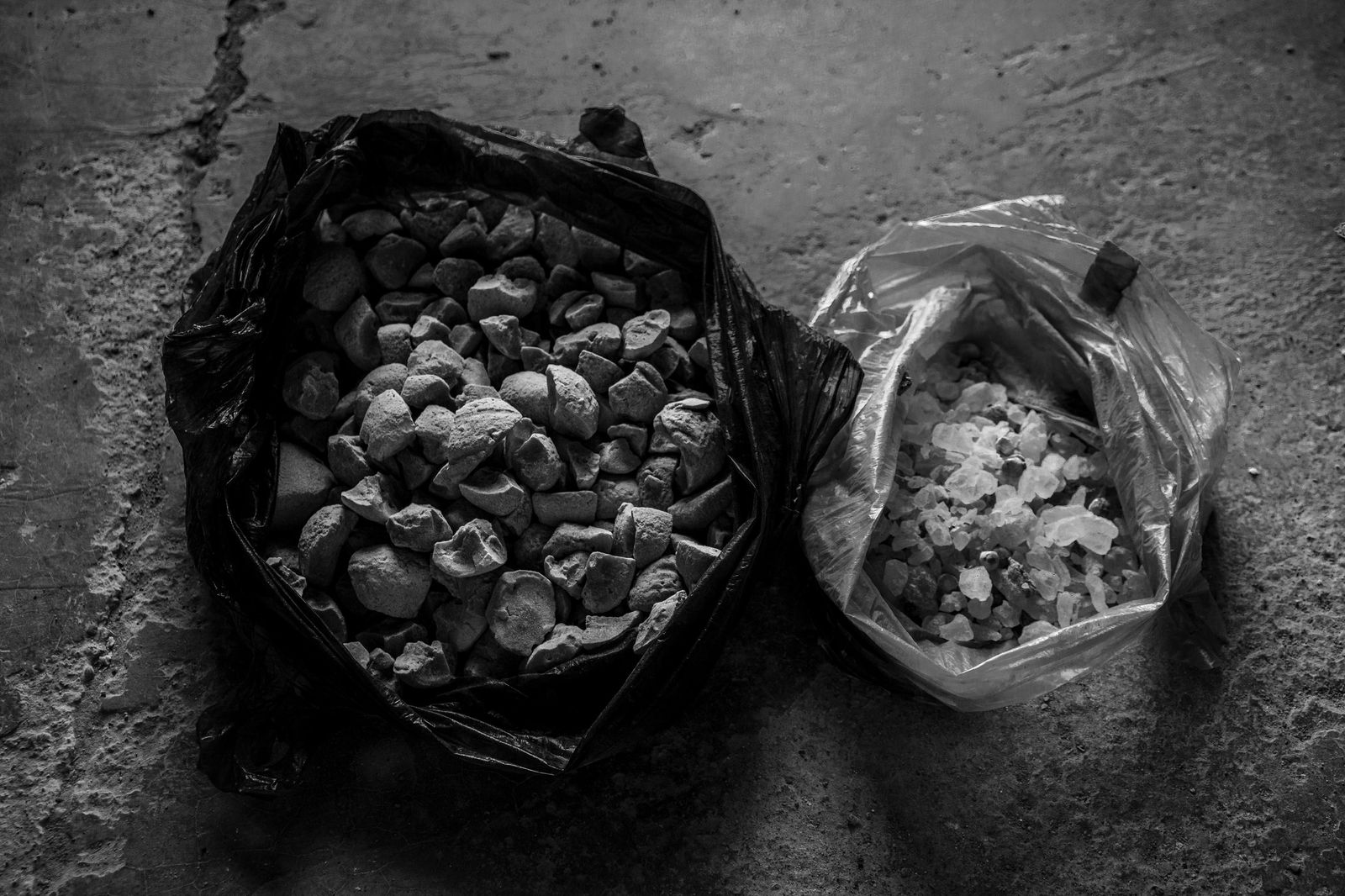 © Zobair Movahhed - Curds and sweets in plastic bags that are used as sustenance fry Afghan refugees during their treks into Iran.