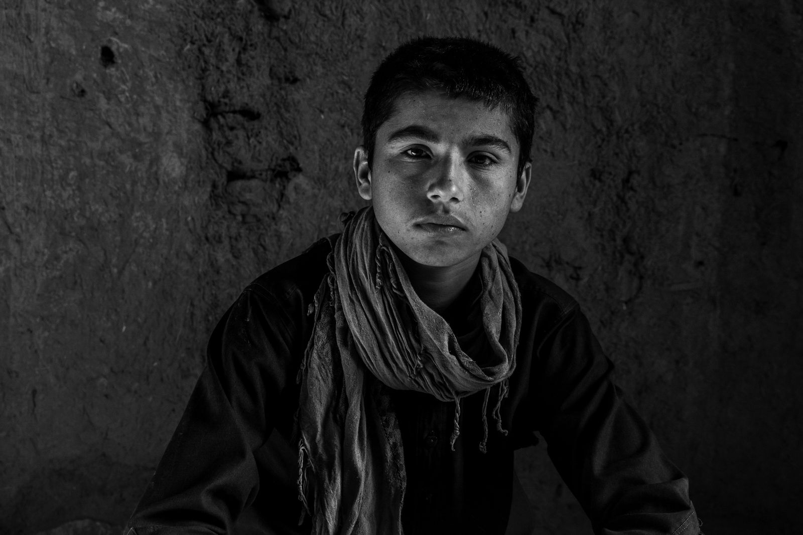 © Zobair Movahhed - A young Afghan refugee, after having recently crossed the border into Iran.